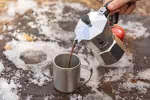 Pouring coffee into a mug from the Bialetti Moka Express.