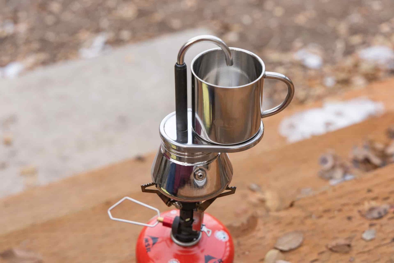 The GSI Mini Espresso sitting atop a backpacking stove.