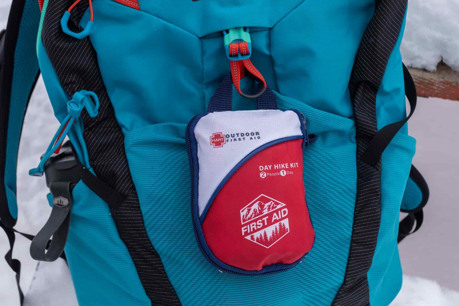 The HART Day Hike clipped outside a bag.