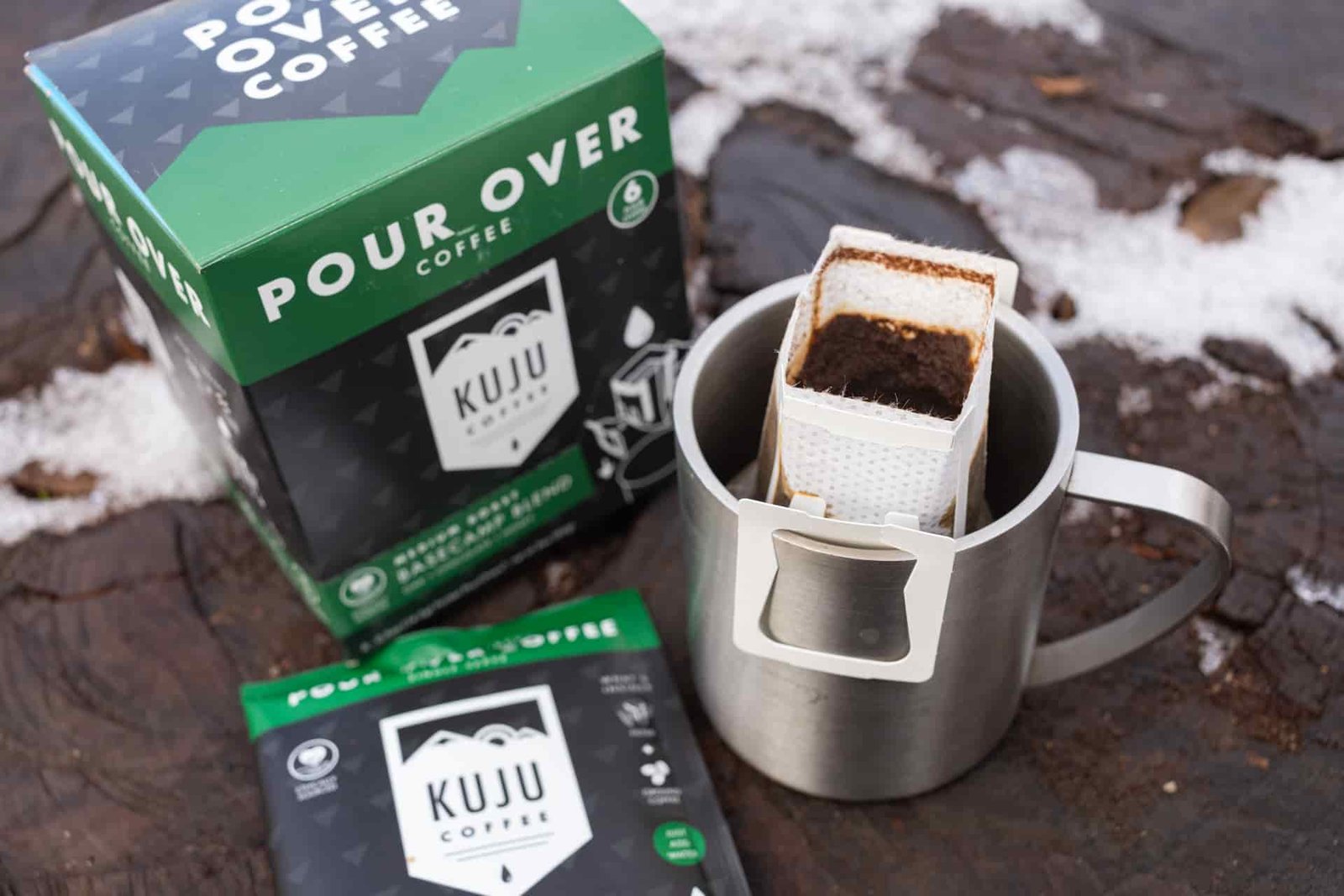 A Kuju coffee pouch sitting in a mug.