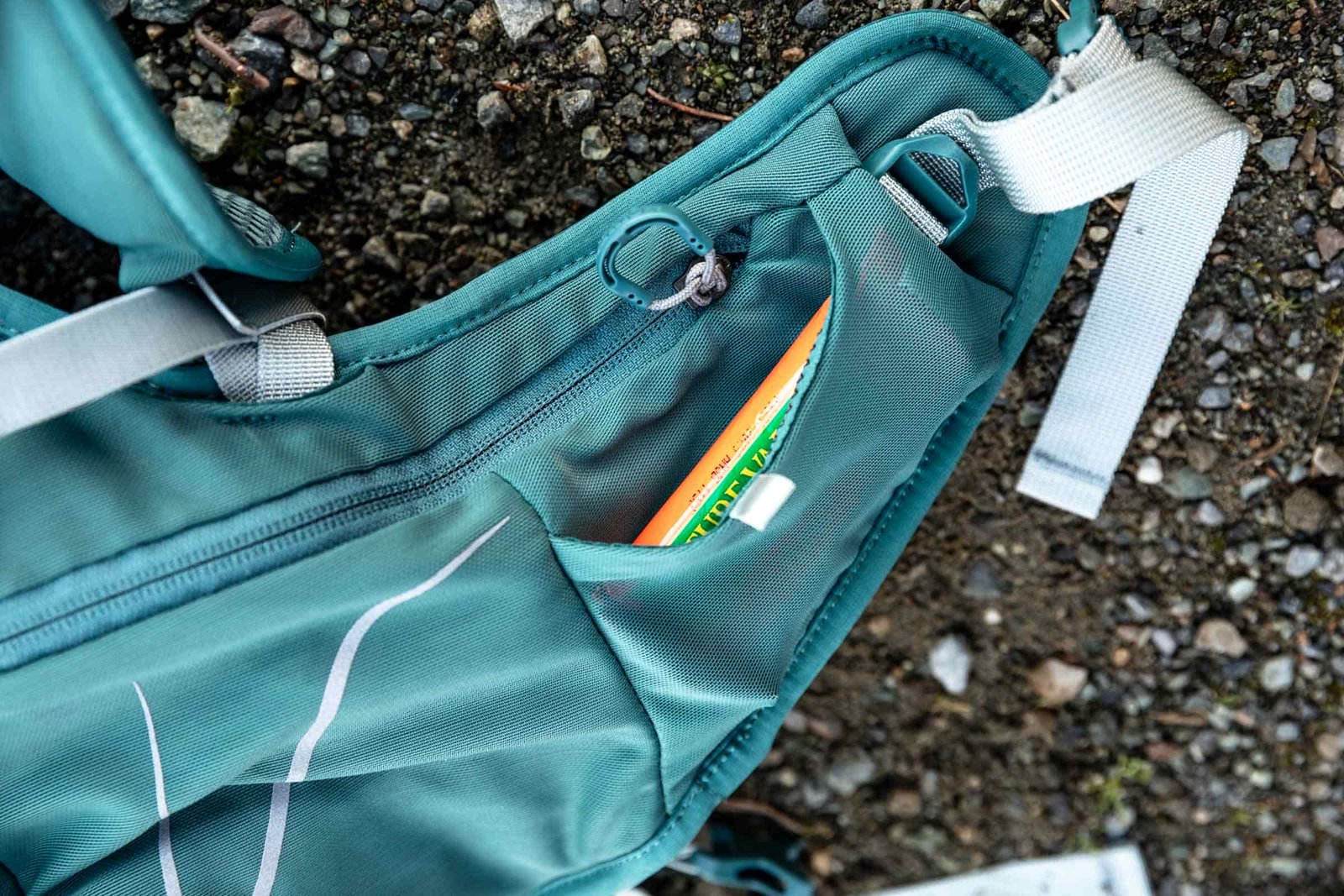 Details of Osprey Dyna 15L - a snack bar is in a hip belt pouch without a zipper