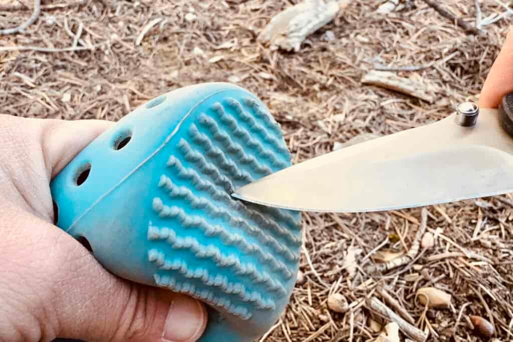 Close up of a WagWellies boot being poked with a knife.