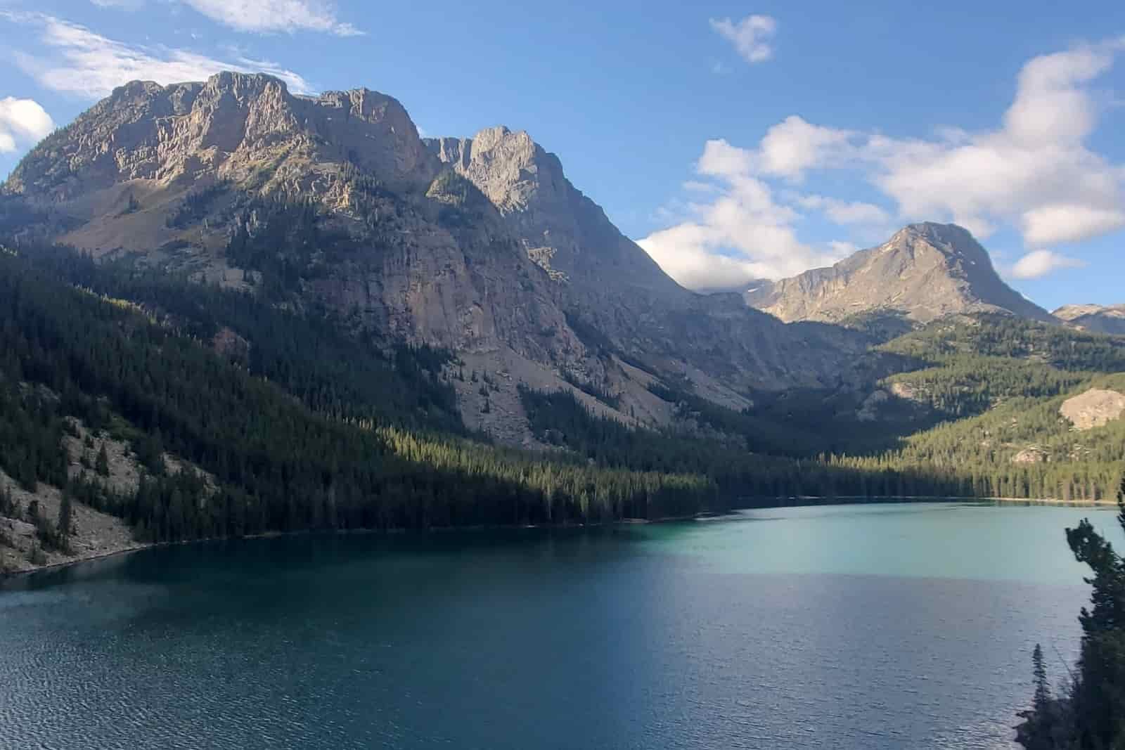An alpine lake with sweeping mountain views.