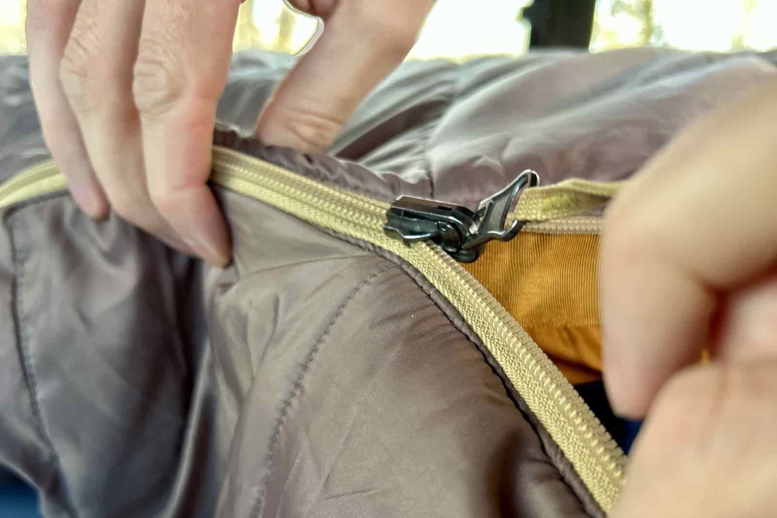 Close up image of a zipper on a sleeping bag.