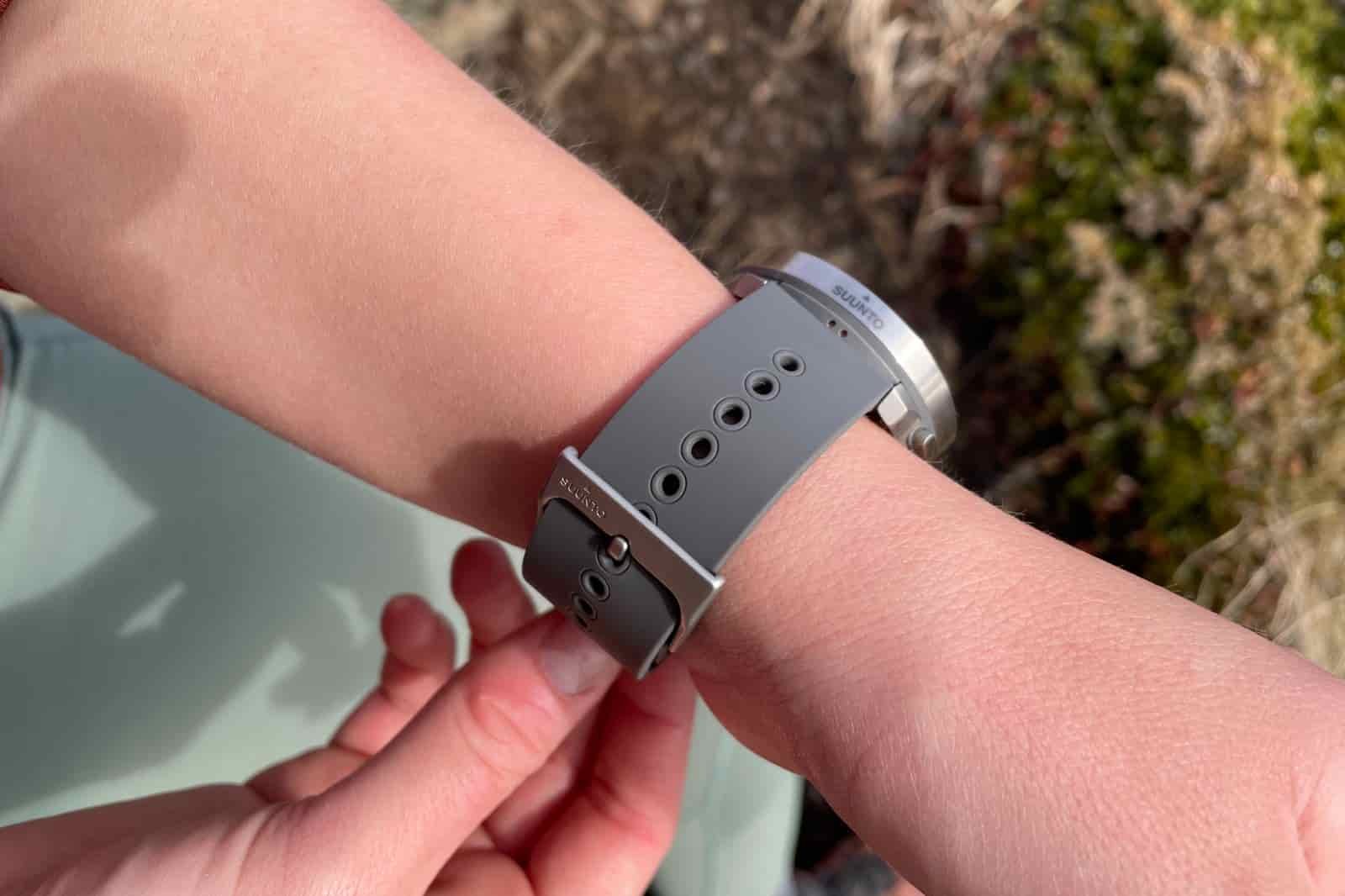 A closeup of a GPS watch worn on the wrist.