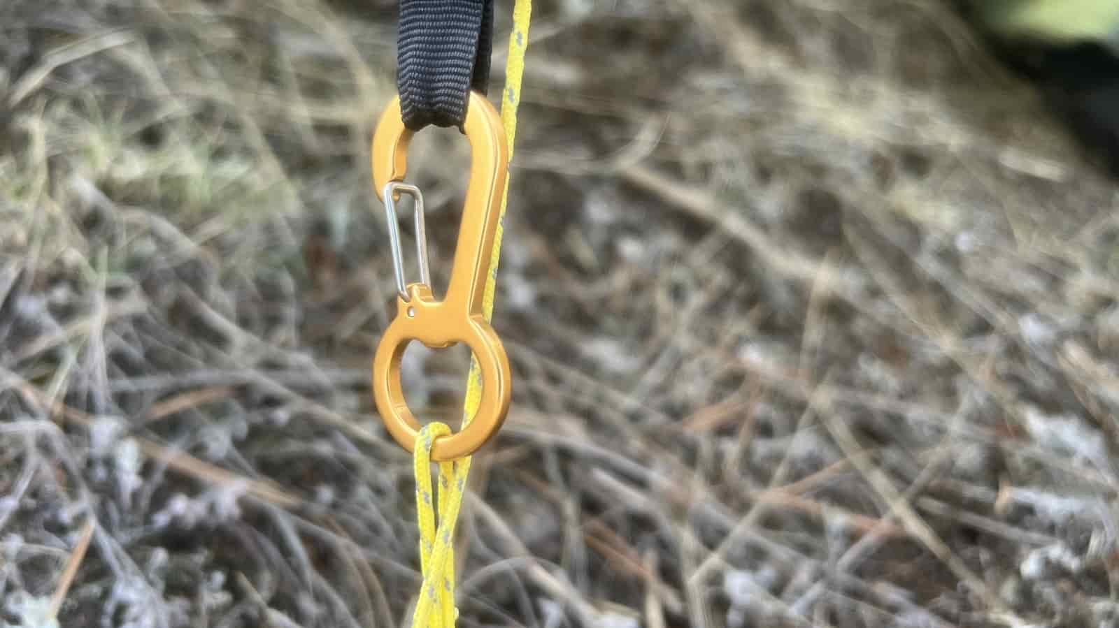 a close up of a carabiner adjustment device