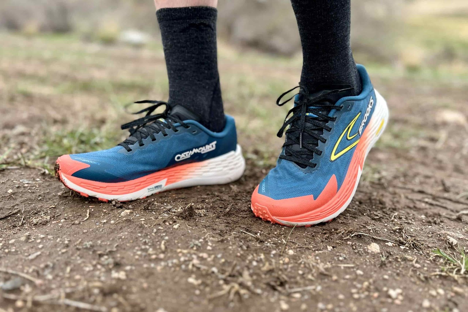 Close up from ankles down of a person in trail running shoes
