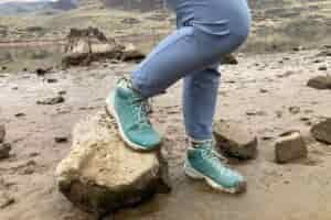 Hiker wearing the Oboz Katabatic LT Mid Gore-Tex Hiking Boots on a riverbank