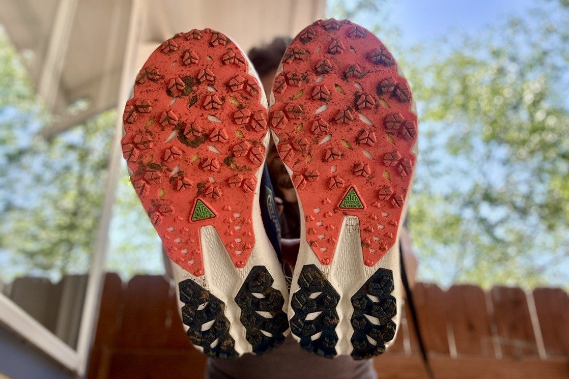 Close up of the traction on a pair of trail runners.