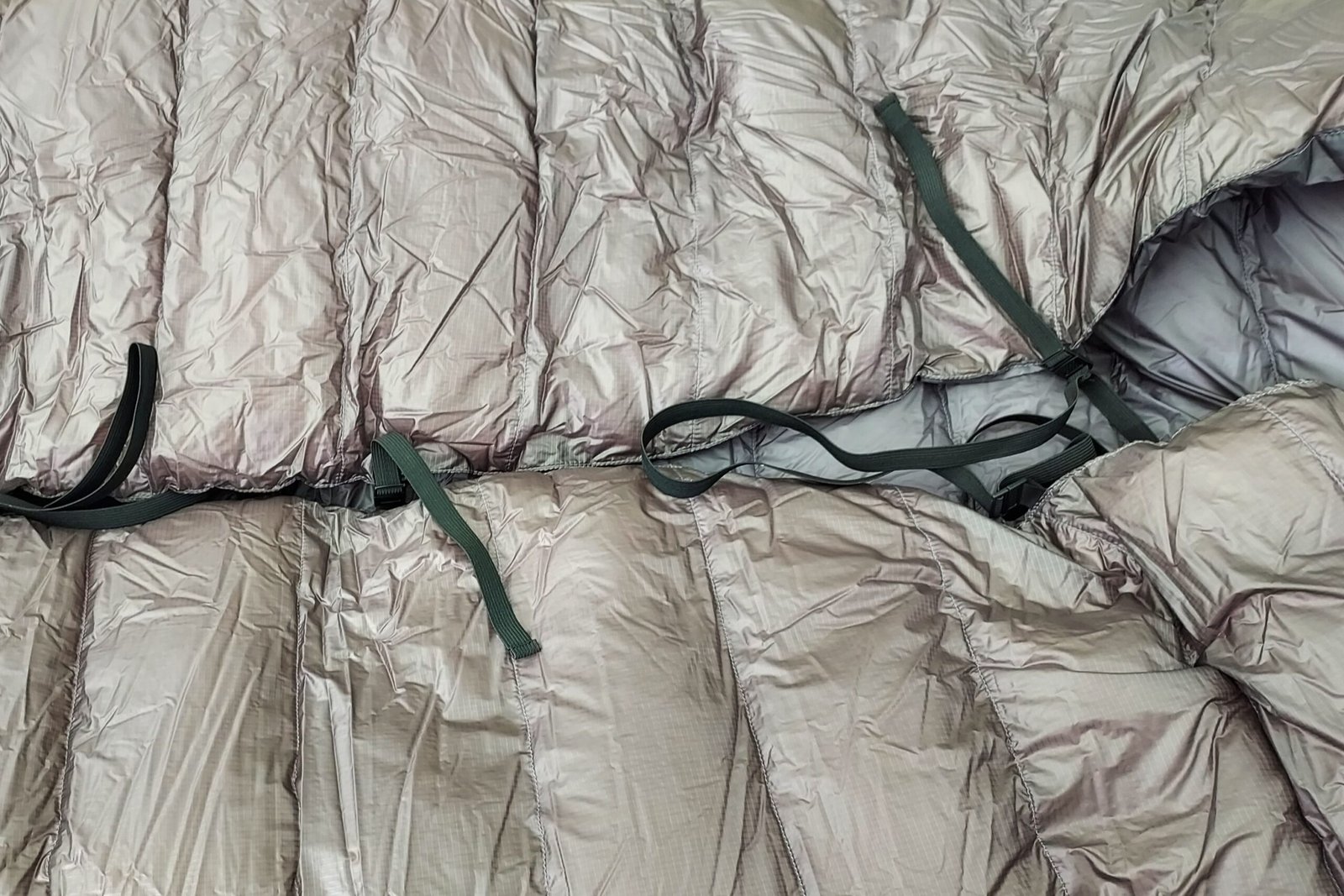 The pad straps for the Western Mountaineering AstraLite Quilt