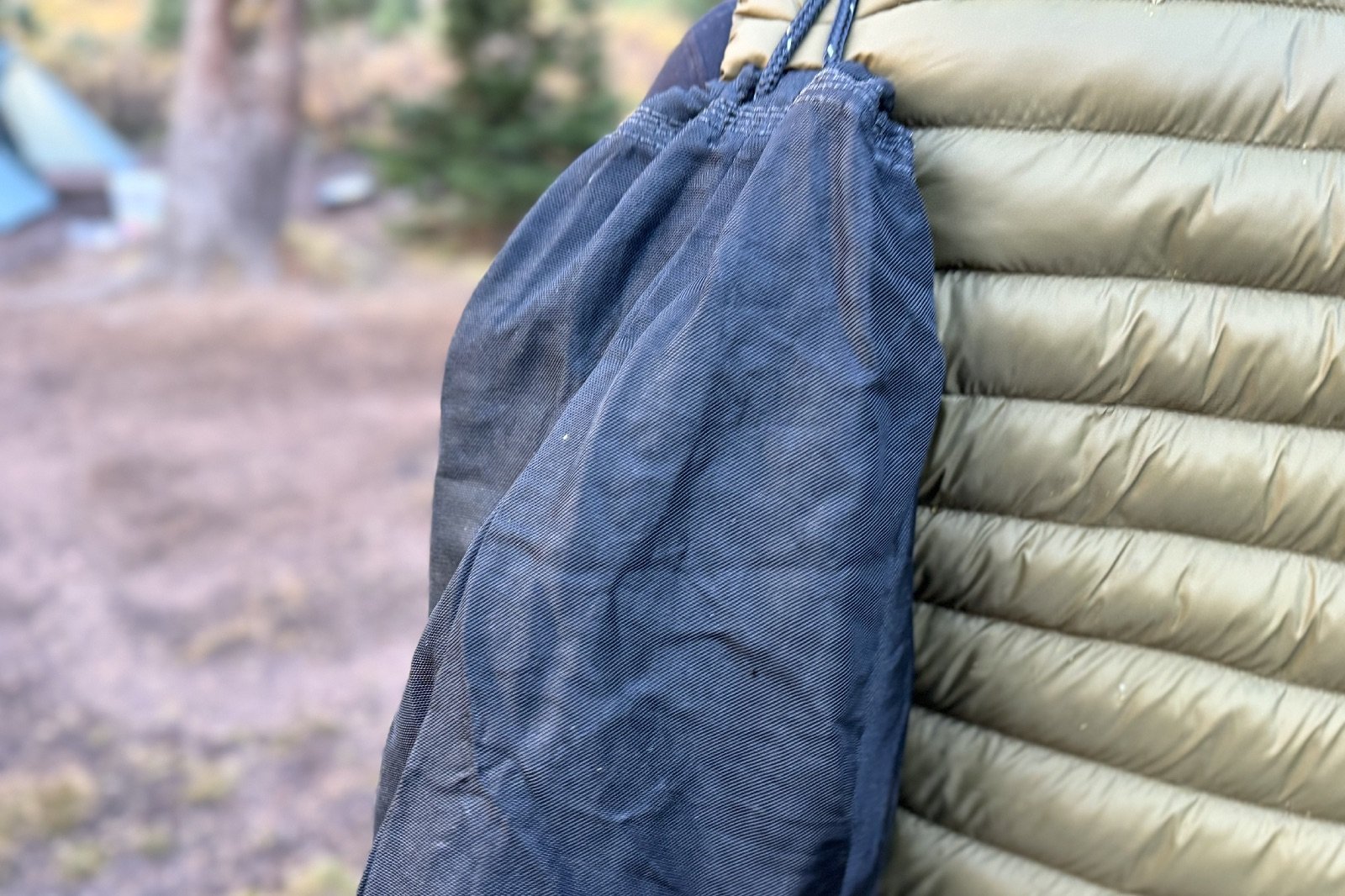 a close up of an Ursack slung over a hiker's shoulder