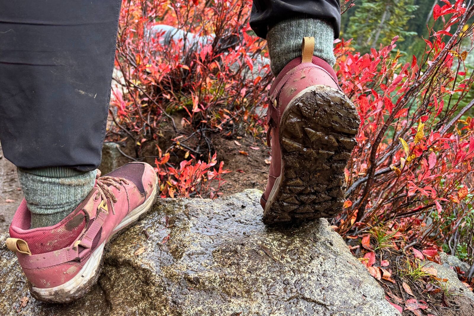 Hiker showing the muddy tread of the Teva Grandview GTX Mid women’s hiking boots