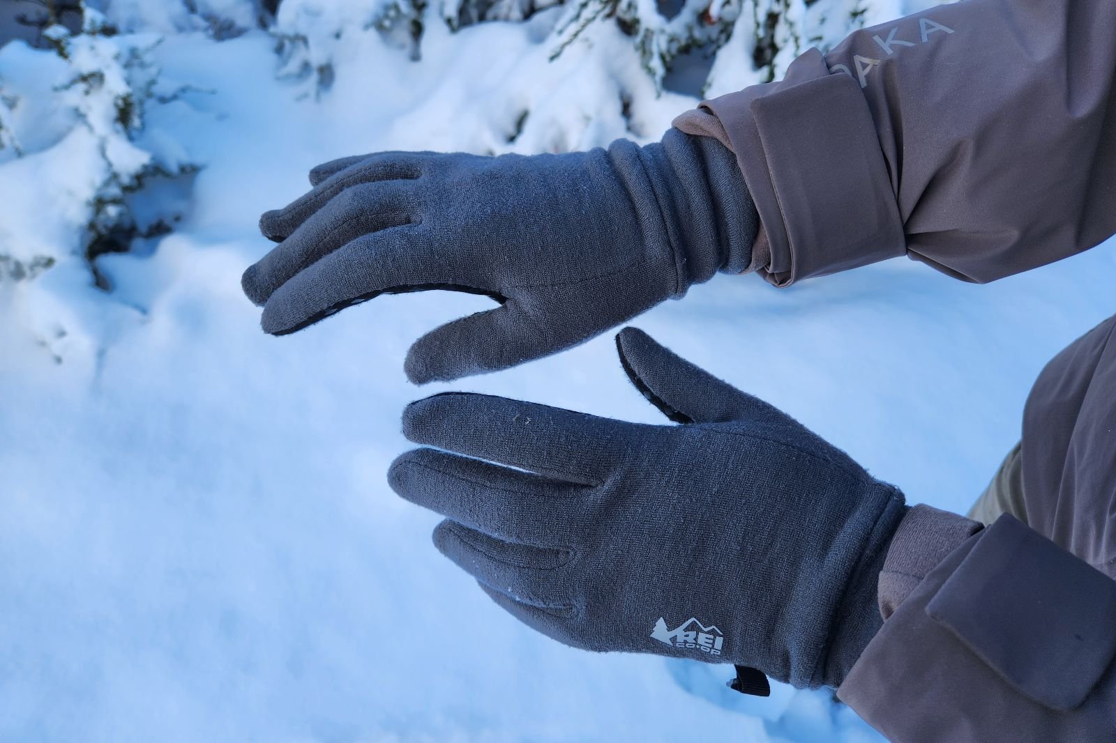 A closeup of the back of the hands of liner gloves.