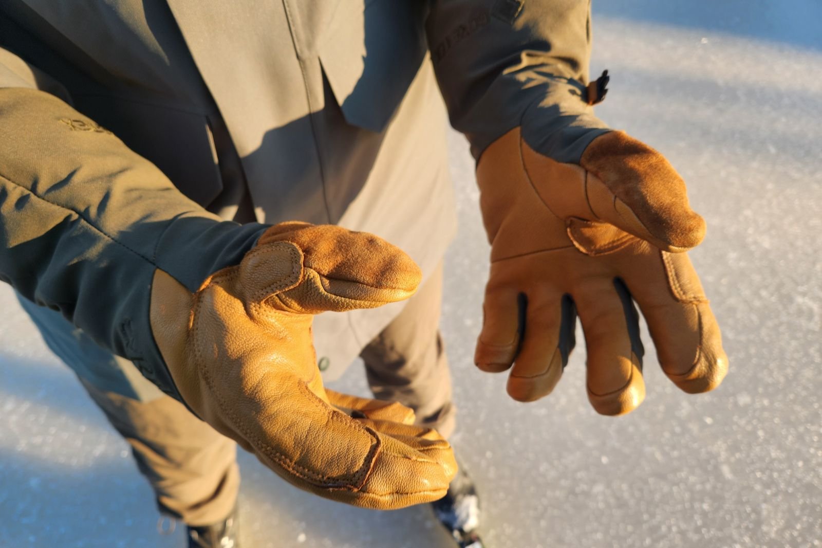 A close up of the palms of leather palmed gloves.