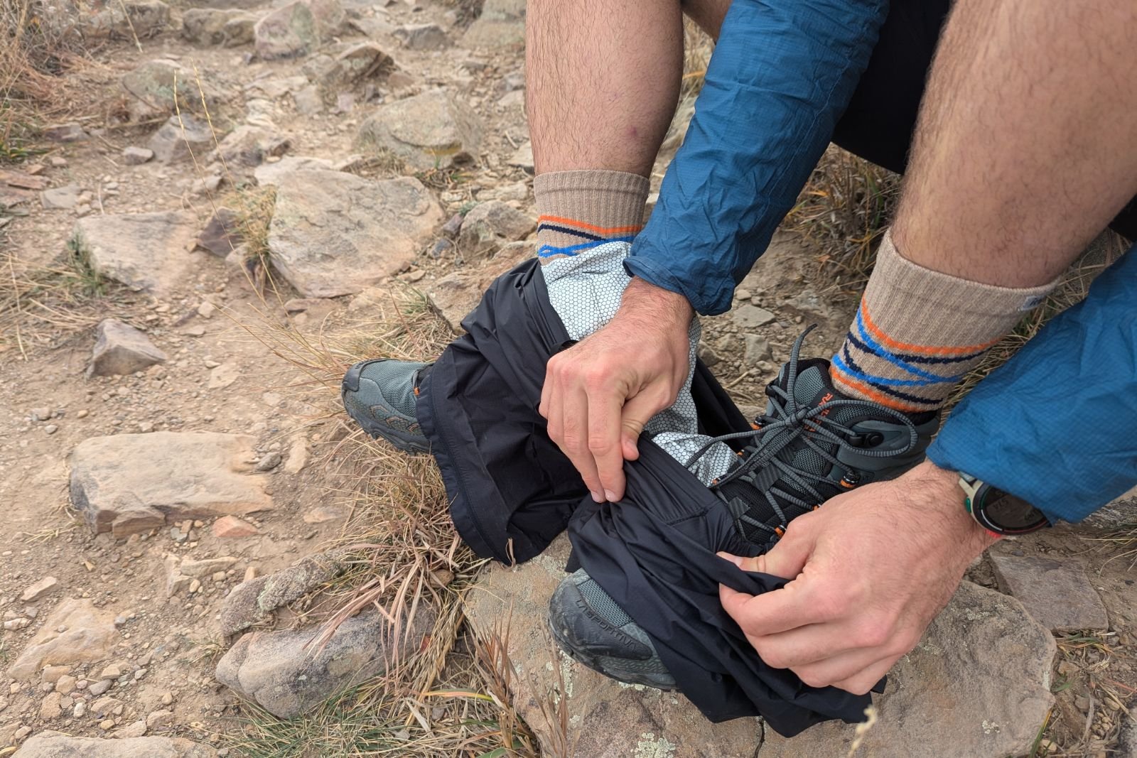 Showing the Salomon Bonatti pants slipping off over a pair of waterproof boots.