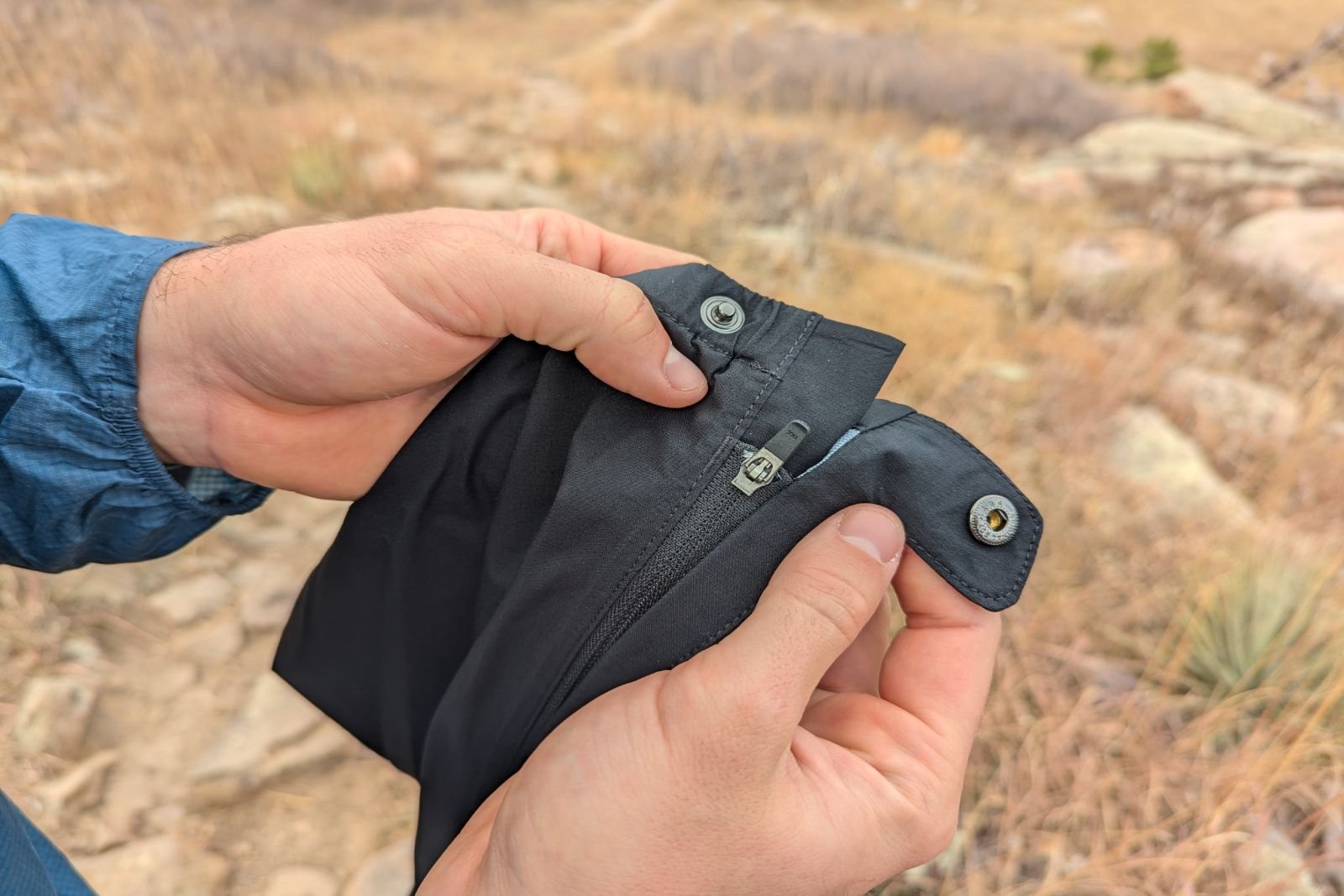 Showing the ankle closure and snap buckle on the Mountain Hardware Stretch Ozonic pants.