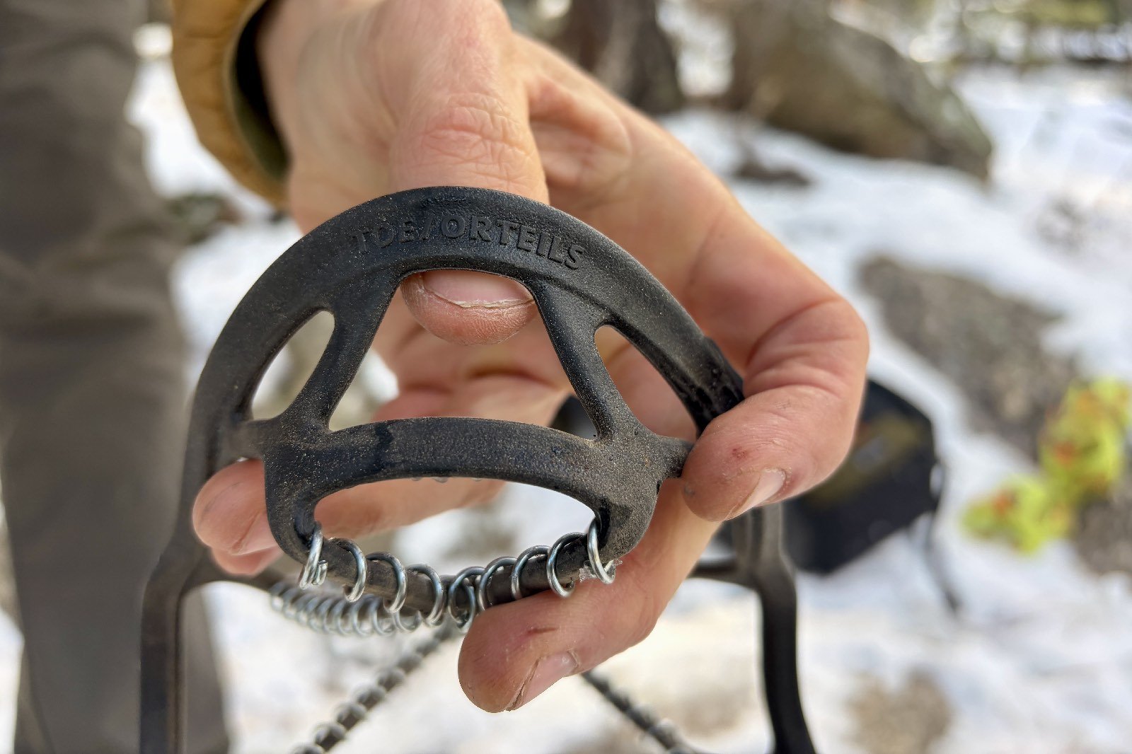 a close up of the toe markings on the rubber harness of a yaktrax device